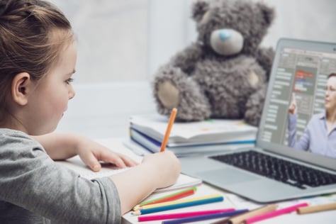 Child using laptop for e-learning